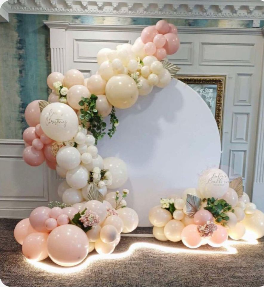 Christening balloon arch with circular backdrop by Lulu's Events