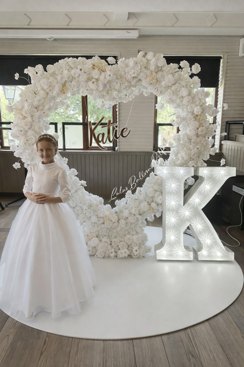 Stunning communion flower heart arch setup by Lulu's Events Belfast