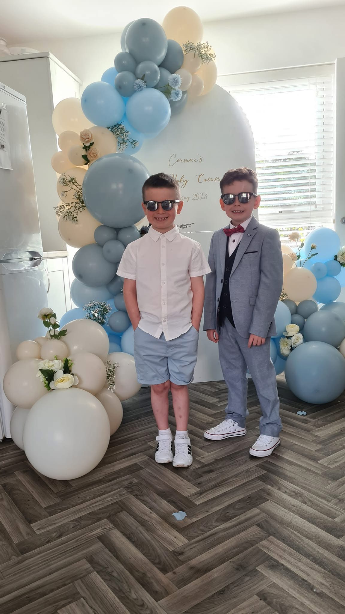 Holy Communion balloon arch in blue and cream