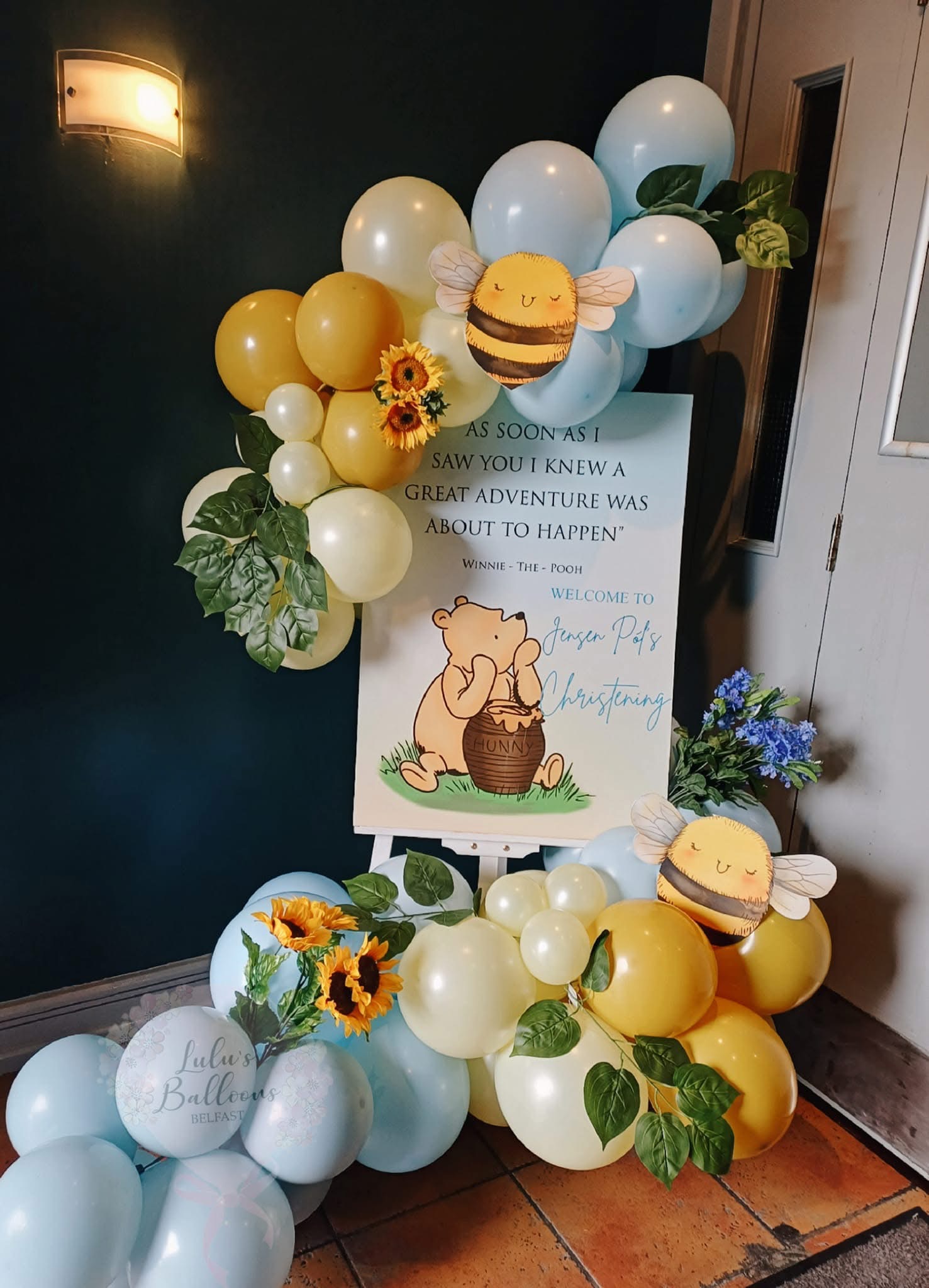 Christening welcome sign with Winnie the Pooh balloons